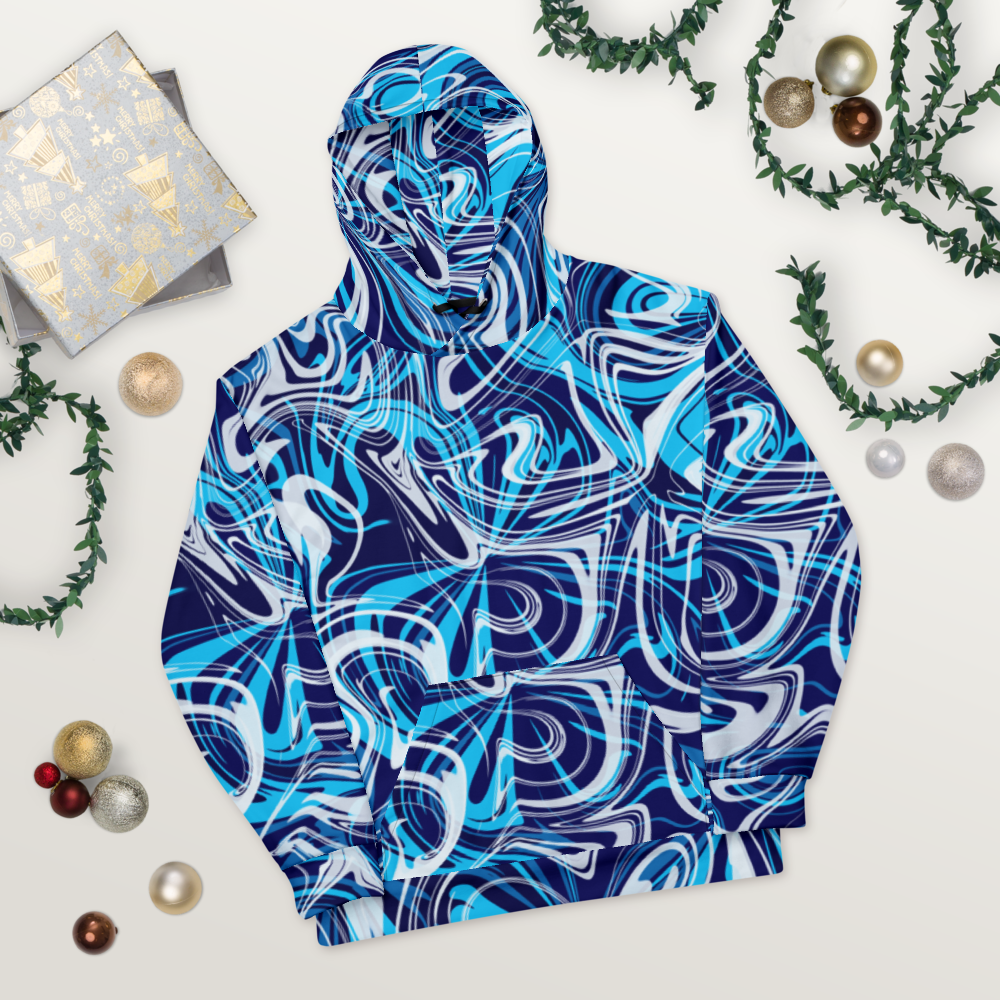 A blue, teal, white, and navy abstract swirl patterned hoodie laid flat on a light wooden surface.  The design features bold, fluid lines that create a vibrant, modern look. The hoodie's front pocket and hood are visible, showing the seamless all-over print. Festive ornaments, greenery, and wrapped gifts are arranged around it for a decorative, holiday-inspired presentation.