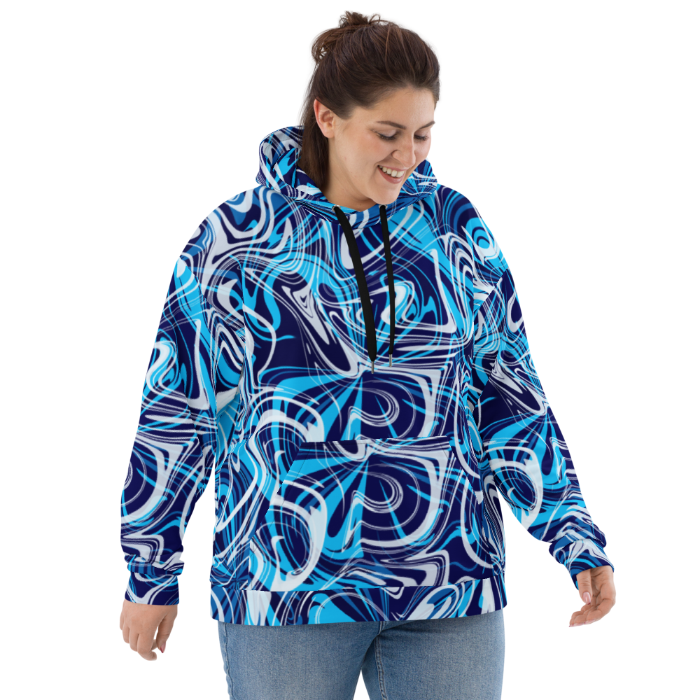 A woman wearing a plus-size bright blue, teal, white, and navy abstract swirl patterned hoodie with black drawstrings.  The hoodie has a relaxed fit  and features bold, fluid lines in an artistic, modern design. She is smiling and looking down, showcasing the front of the hoodie against a neutral background.