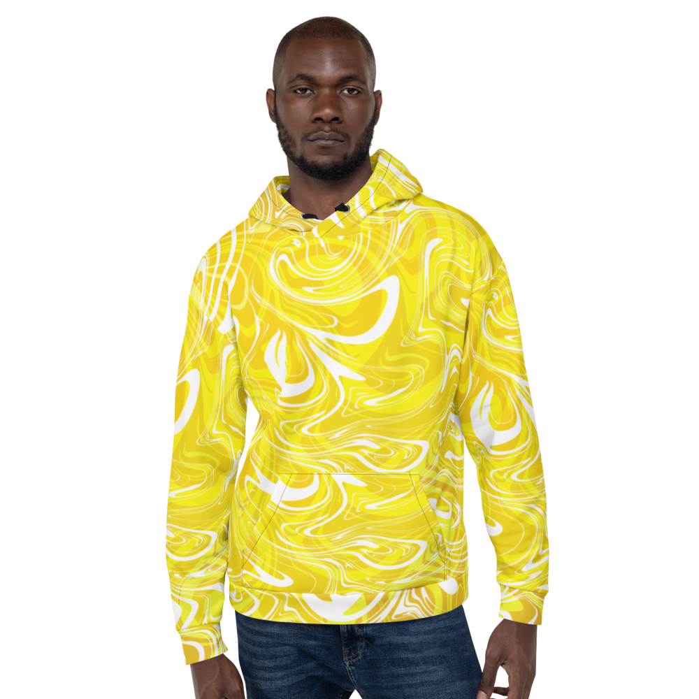 A man wearing a vibrant yellow and white abstract swirl patterned hoodie. The design features bold fluid lines and curves that create a modern, artistic look. The hoodie has a relaxed fit with a front pocket and ribbed cuffs, paired with dark jeans against a neutral checkered background.